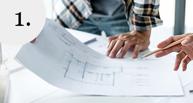 two people looking at interior plans